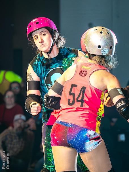 LeBrick House looking around another skater in pink. Photo by PreFlash Gordon.